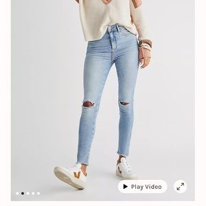 Size 28, high wasted black skinny jeans with holes in knees